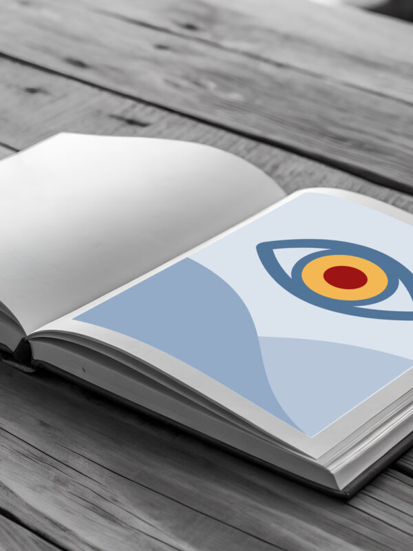 Fotorealistisches KI-Bild: aufgeschlagenes Buch; eine Seite ist gefüllt mit einer Platzhaltergrafik mit Auge